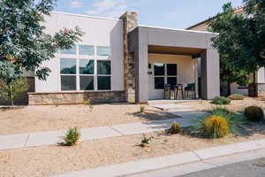 View of front of home with stone siding and stucco siding