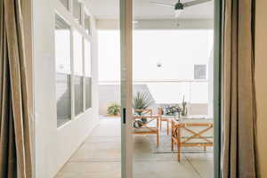 Entryway with healthy amount of natural light and a ceiling fan