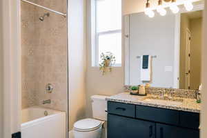 Full bathroom with vanity and shower / washtub combination