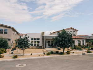 View of front facade featuring stucco siding