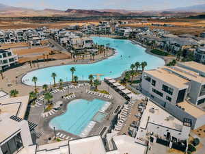 Aerial overview of property's location featuring a water and mountain view and a pool area