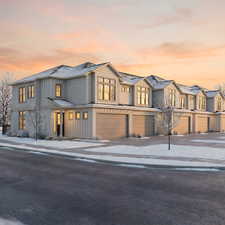 Modern farmhouse featuring a garage, concrete driveway, and board and batten siding