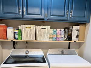 Washroom featuring independent washer and dryer