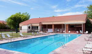 Community pool featuring a patio
