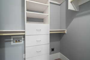 Washroom with washer hookup and baseboards