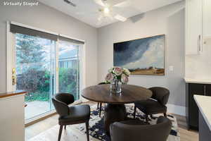 Dining space with light wood-type flooring and ceiling fan