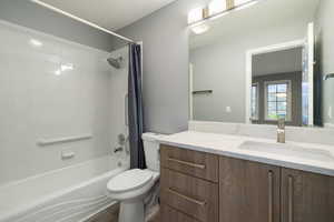 Full bathroom with vanity and shower / tub combo
