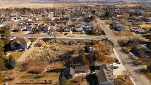 Aerial overview of property's location with nearby suburban area