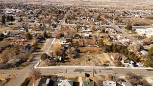 Aerial view of property's location featuring nearby suburban area