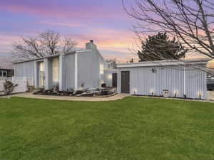 Rear view of property with a chimney