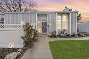 View of front facade featuring a chimney