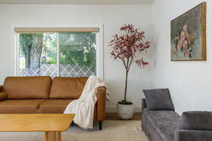 Living room featuring wood finished floors and baseboards