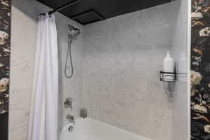 Bathroom featuring shower / bath combo