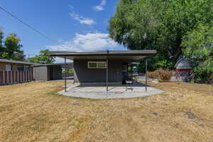 Rear view of house featuring a patio area