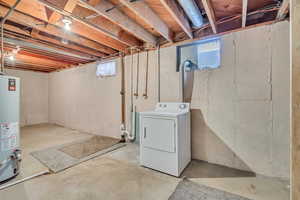 Below grade area with washer / clothes dryer and gas water heater