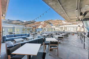 View of patio / terrace with an outdoor living space and a mountain view