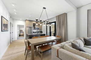 Dining space featuring light wood-style floors and recessed lighting