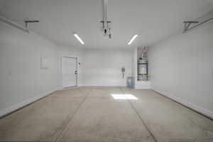 Garage with electric panel and water heater