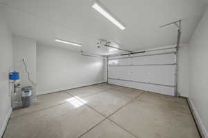 Garage featuring baseboards