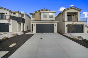 View of front of home featuring stucco siding, concrete driveway, a garage, a balcony, and a tiled roof