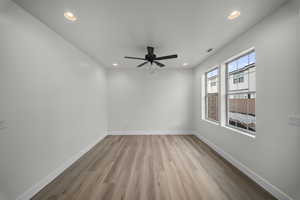 Empty room with recessed lighting, light wood finished floors, and ceiling fan