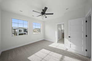 Unfurnished bedroom featuring a ceiling fan, light carpet, and recessed lighting