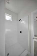 Full bathroom with a stall shower and carpet