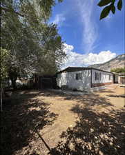 View of home's exterior with a mountain view