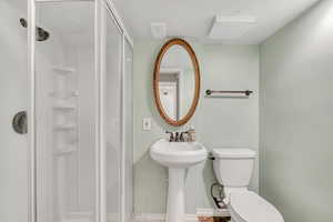 Bathroom featuring a shower stall