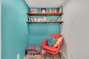 Living area featuring carpet flooring