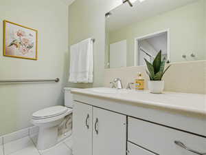Bathroom with vanity and light tile patterned floors