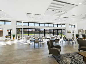 Common area with a towering ceiling and recessed lighting