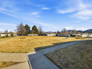 View of green lawn with a mountain view