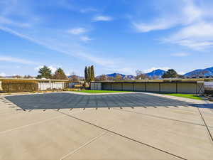 View of patio / terrace with a community pool and a mountain view
