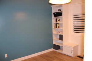 Unfurnished bedroom with light wood-type flooring and baseboards