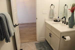 Bathroom with vanity and light wood-style flooring