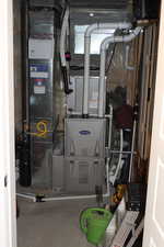 Utility room featuring heating unit