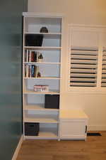 Detailed view of wood finished floors and baseboards