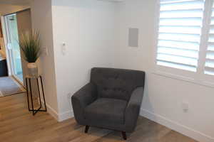 Living area featuring wood finished floors and baseboards