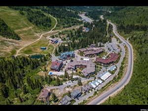 Aerial view of property's location with a forest