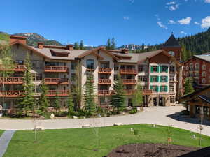 View of apartment building / complex featuring a mountain view
