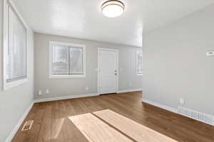 Empty room featuring light wood-style floors and baseboards