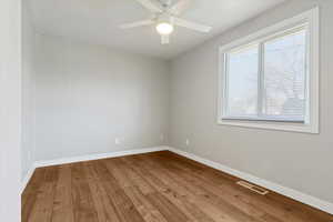 Spare room featuring light wood finished floors and ceiling fan