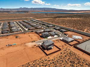 Aerial view of residential area with a mountainous background and a desert landscape