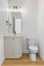 Bathroom with vanity and light wood finished floors