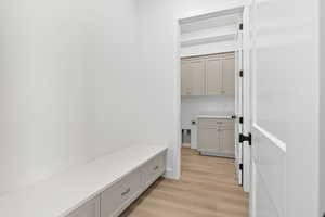 Mudroom with light wood finished floors