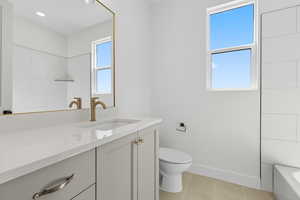 Bathroom featuring vanity and light tile patterned floors