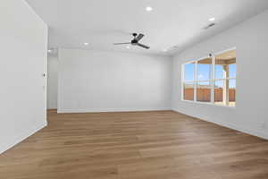 Empty room with light wood-style floors, recessed lighting, and ceiling fan