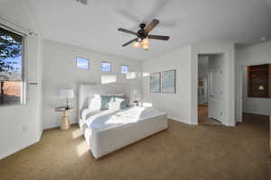 Bedroom with carpet, ceiling fan, and multiple windows