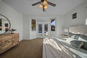 Bedroom with french doors, access to outside, carpet floors, and ceiling fan